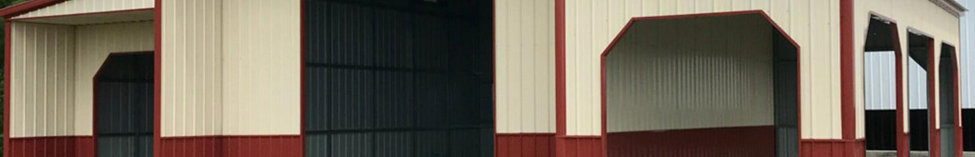 Red and cream colored pre-engineered metal building in Okay, Oklahoma.