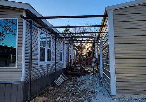 Spanning roof installation between hose and garage in Tulsa, OK