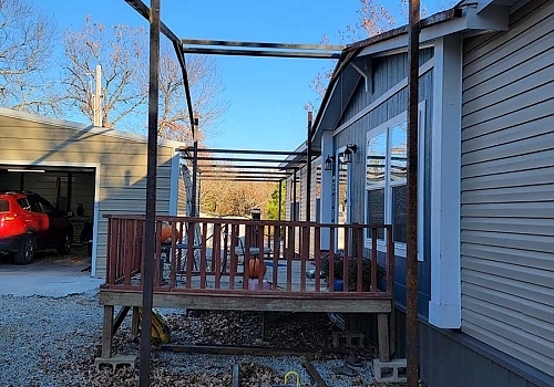 Spanning roof installation between hose and garage in Tulsa, OK